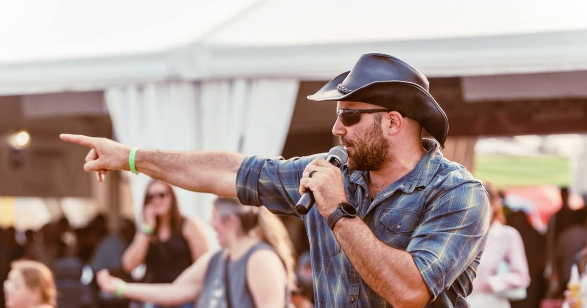 Mario of Urban Cowboy Line Dancing leading the audience in Line Dancing Lessons.